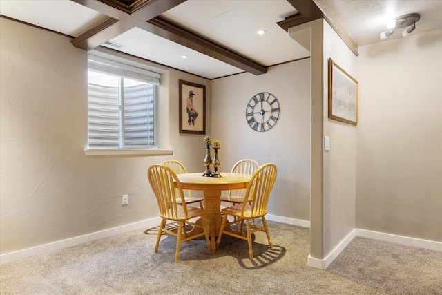 dining space with beam ceiling, coffered ceiling, and carpet floors