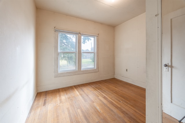 unfurnished room with light wood-type flooring