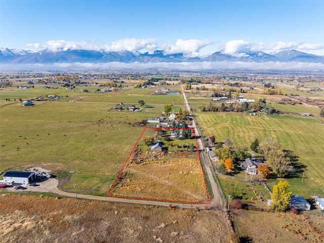 drone / aerial view with a mountain view and a rural view