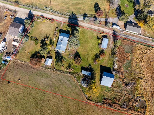 birds eye view of property featuring a rural view