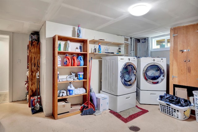 laundry area with washing machine and clothes dryer