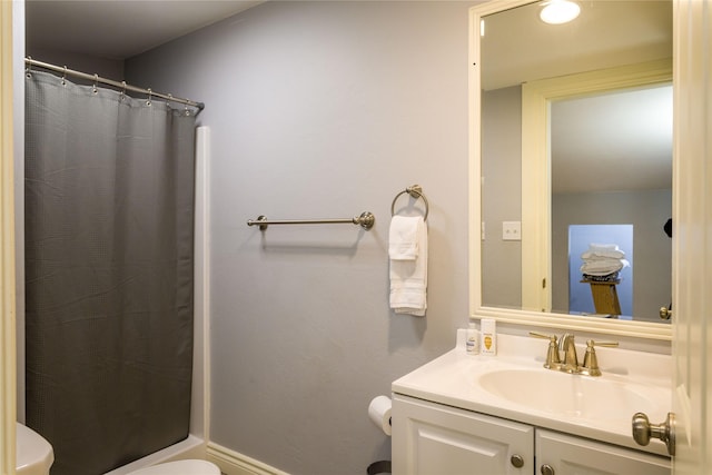 154 Riverside Dr, Kalispell, MT 59901 - bathroom with toilet, vanity, curtained shower, and baseboards