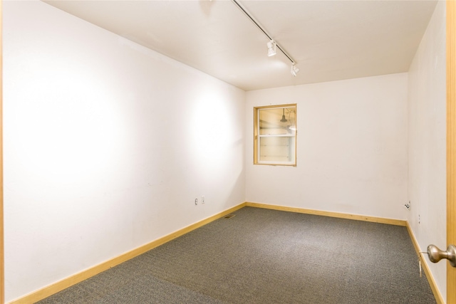 154 Riverside Dr, Kalispell, MT 59901 - carpeted empty room with track lighting and baseboards