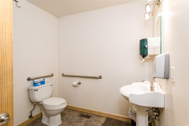 154 Riverside Dr, Kalispell, MT 59901 - bathroom featuring toilet and baseboards