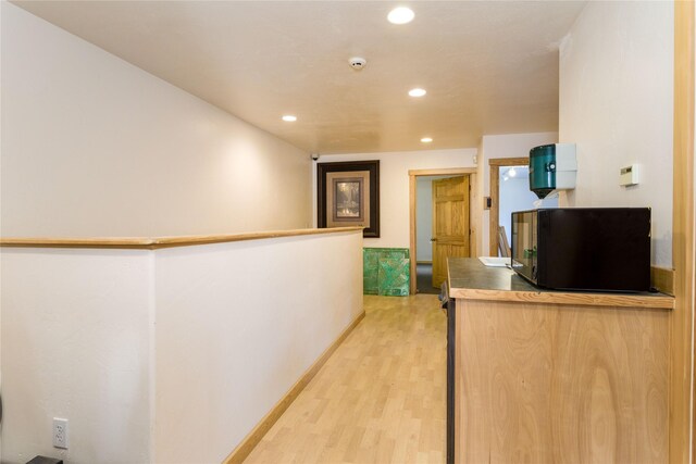154 Riverside Dr, Kalispell, MT 59901 - interior space with recessed lighting, black microwave, light wood-style floors, and baseboards