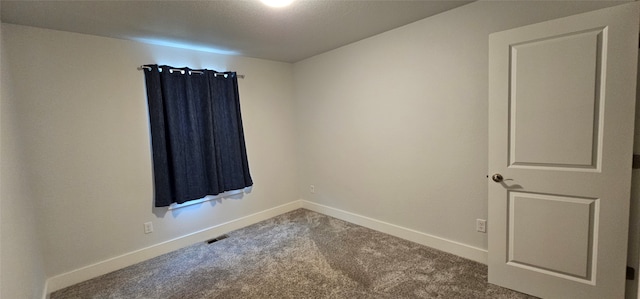 empty room featuring carpet flooring