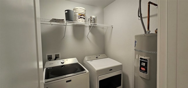 laundry area featuring washer and clothes dryer and secured water heater