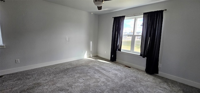 spare room with carpet and ceiling fan