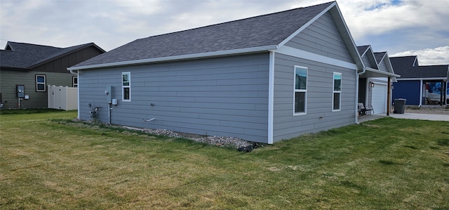 view of home's exterior with a yard