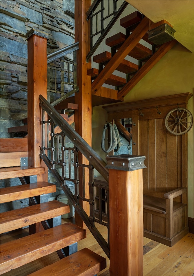 stairs with hardwood / wood-style flooring