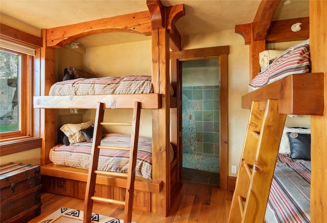 bedroom with wood-type flooring