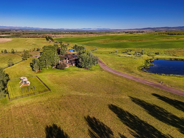 drone / aerial view featuring a water view and a rural view