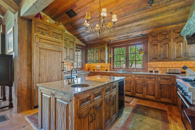 kitchen with lofted ceiling, wood ceiling, dark wood-type flooring, an island with sink, and sink