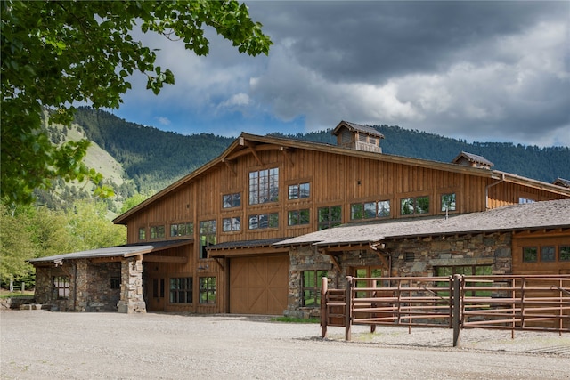 view of front of house featuring a mountain view and a garage