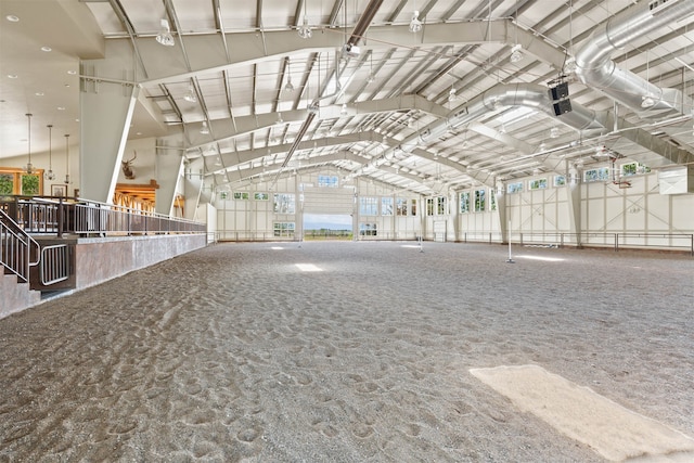 miscellaneous room featuring lofted ceiling and carpet