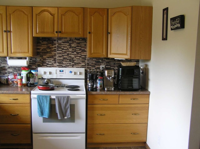 kitchen with white electric range and backsplash