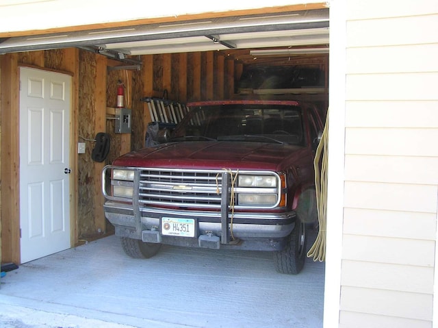 garage featuring wooden walls