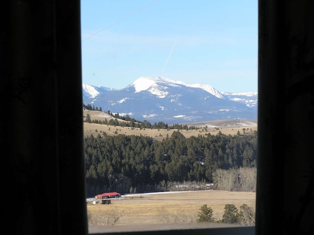 view of mountain feature with a rural view