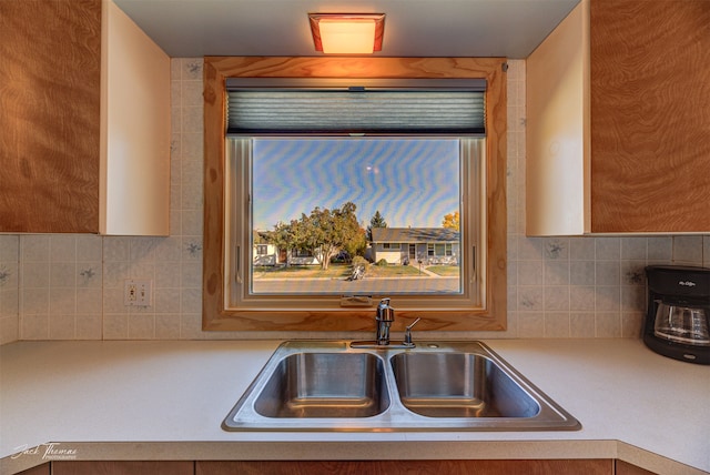 kitchen featuring stainless steel appliances and tasteful backsplash