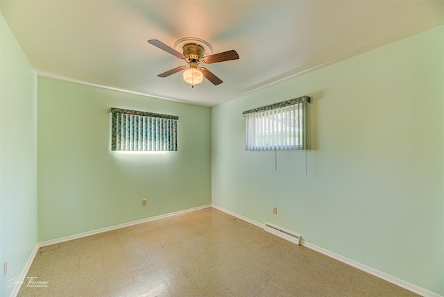 basement with a paneled ceiling and tile patterned floors