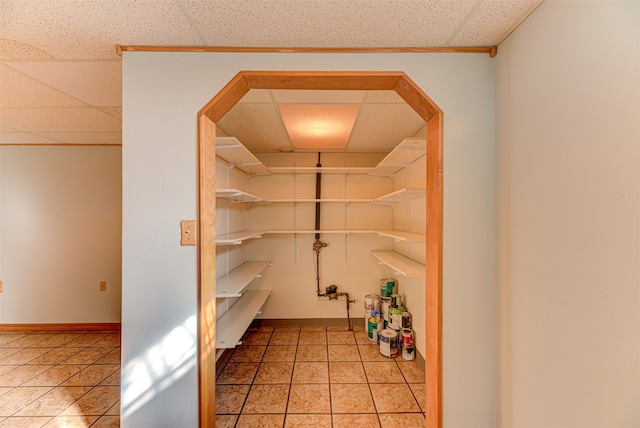 misc room with light colored carpet and a drop ceiling