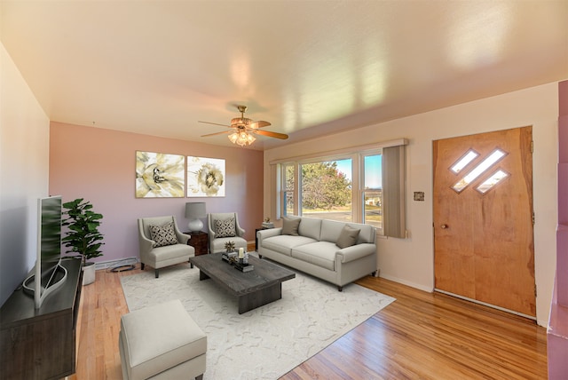 unfurnished room featuring ceiling fan, light hardwood / wood-style flooring, and baseboard heating