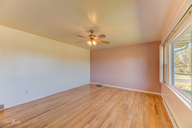 entrance foyer with light wood-type flooring, ceiling fan, and a baseboard radiator