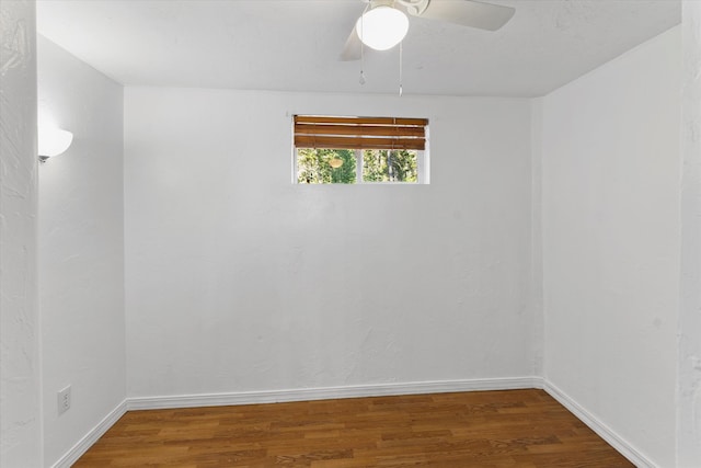 unfurnished room with ceiling fan and dark hardwood / wood-style floors