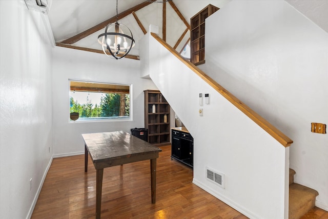 office space featuring beam ceiling, high vaulted ceiling, dark hardwood / wood-style flooring, and a chandelier