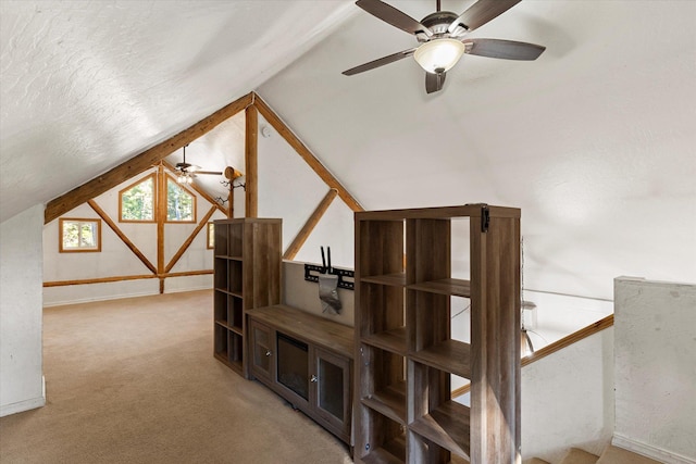 1424 Bierney Creek Rd, Lakeside, MT 59922 - stairway with ceiling fan, vaulted ceiling, carpet flooring, and baseboards