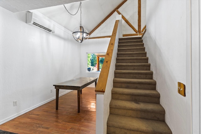 1424 Bierney Creek Rd, Lakeside, MT 59922 - stairs featuring a wall mounted air conditioner, wood finished floors, a chandelier, baseboards, and vaulted ceiling