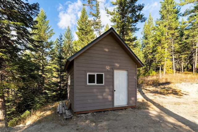 1424 Bierney Creek Rd, Lakeside, MT 59922 - view of shed featuring a forest view