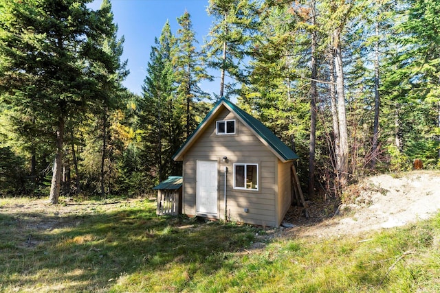 1424 Bierney Creek Rd, Lakeside, MT 59922 - view of outbuilding featuring a forest view