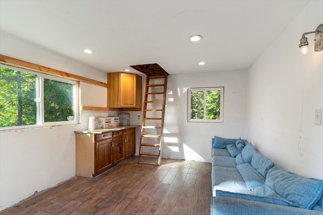 1424 Bierney Creek Rd, Lakeside, MT 59922 - kitchen featuring open floor plan, dark wood finished floors, light countertops, recessed lighting, and brown cabinetry