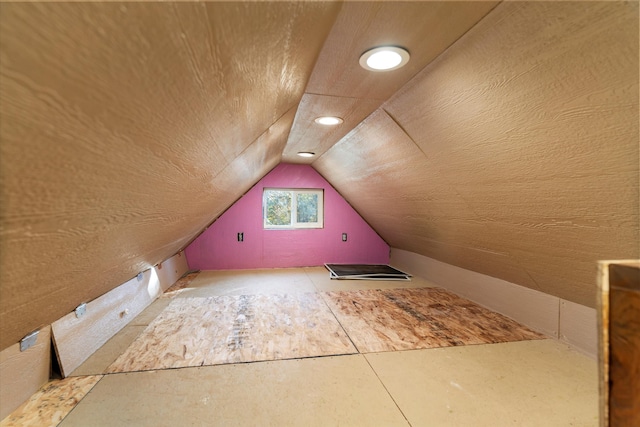 additional living space with vaulted ceiling