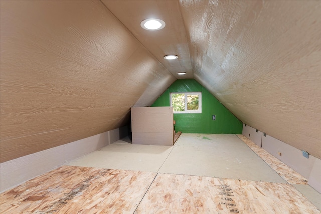 bonus room featuring lofted ceiling