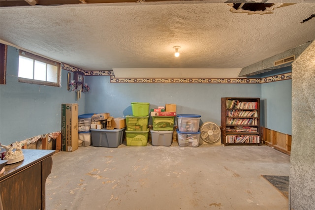 basement with a textured ceiling