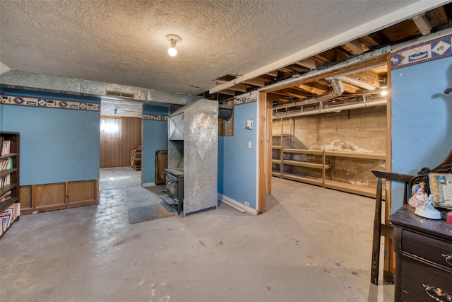 basement featuring a textured ceiling