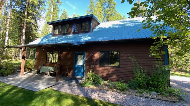 132 Little Mountain Rd, Whitefish, MT 59937 - back of house featuring a patio area and metal roof