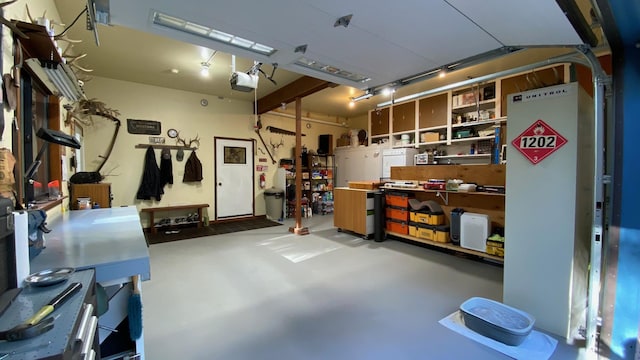 132 Little Mountain Rd, Whitefish, MT 59937 - garage with a garage door opener and a workshop area