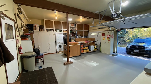 132 Little Mountain Rd, Whitefish, MT 59937 - garage with estacked washer and dryer, a garage door opener, and fridge