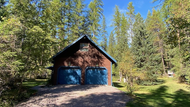 132 Little Mountain Rd, Whitefish, MT 59937 - detached garage featuring a forest view