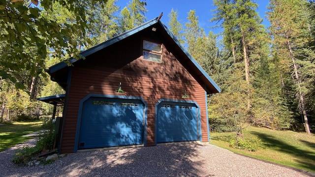 132 Little Mountain Rd, Whitefish, MT 59937 - garage with gravel driveway
