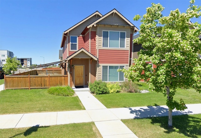 craftsman-style home with a front lawn