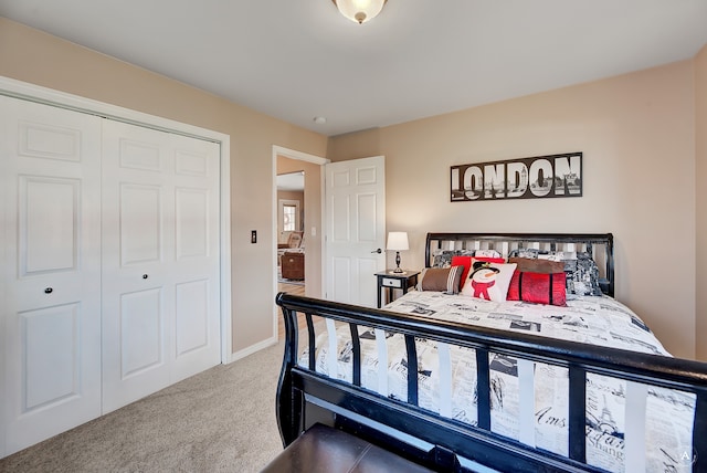 bedroom with light carpet and a closet