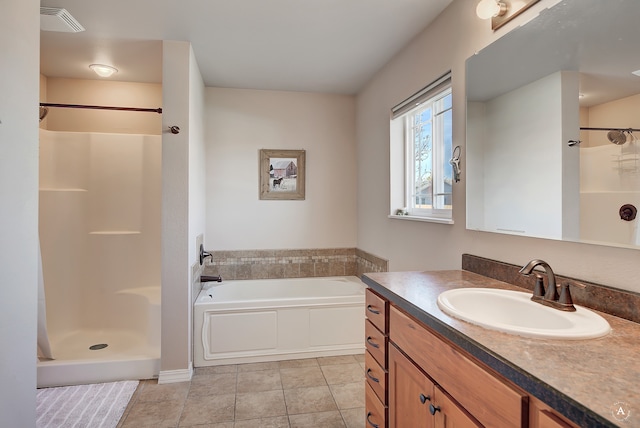 bathroom featuring vanity, independent shower and bath, and tile patterned floors