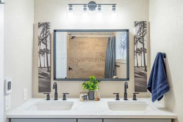 bathroom featuring vanity and a shower with shower curtain