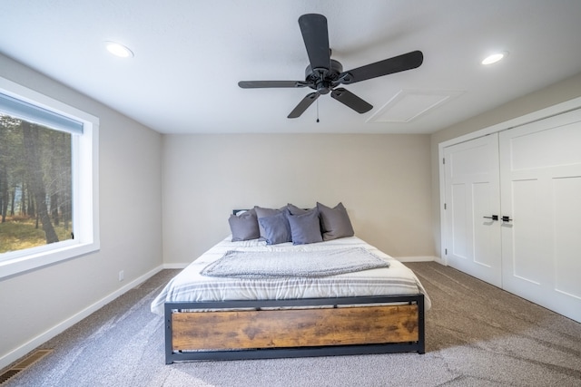 carpeted bedroom with a closet and ceiling fan