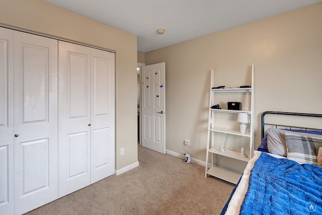 carpeted bedroom with a closet