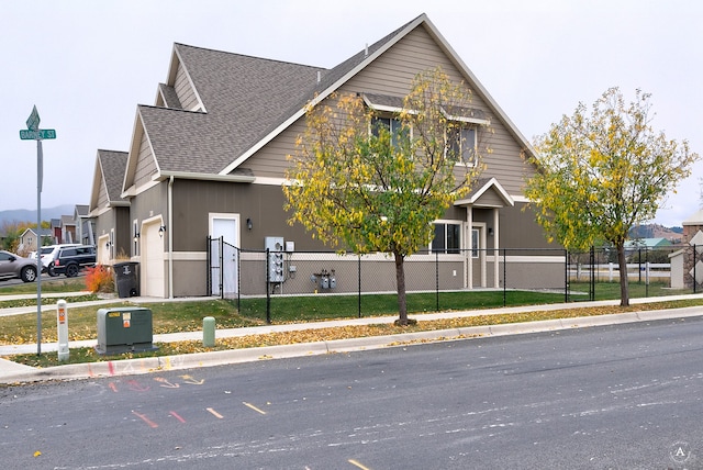 view of front of house featuring a front yard and a garage